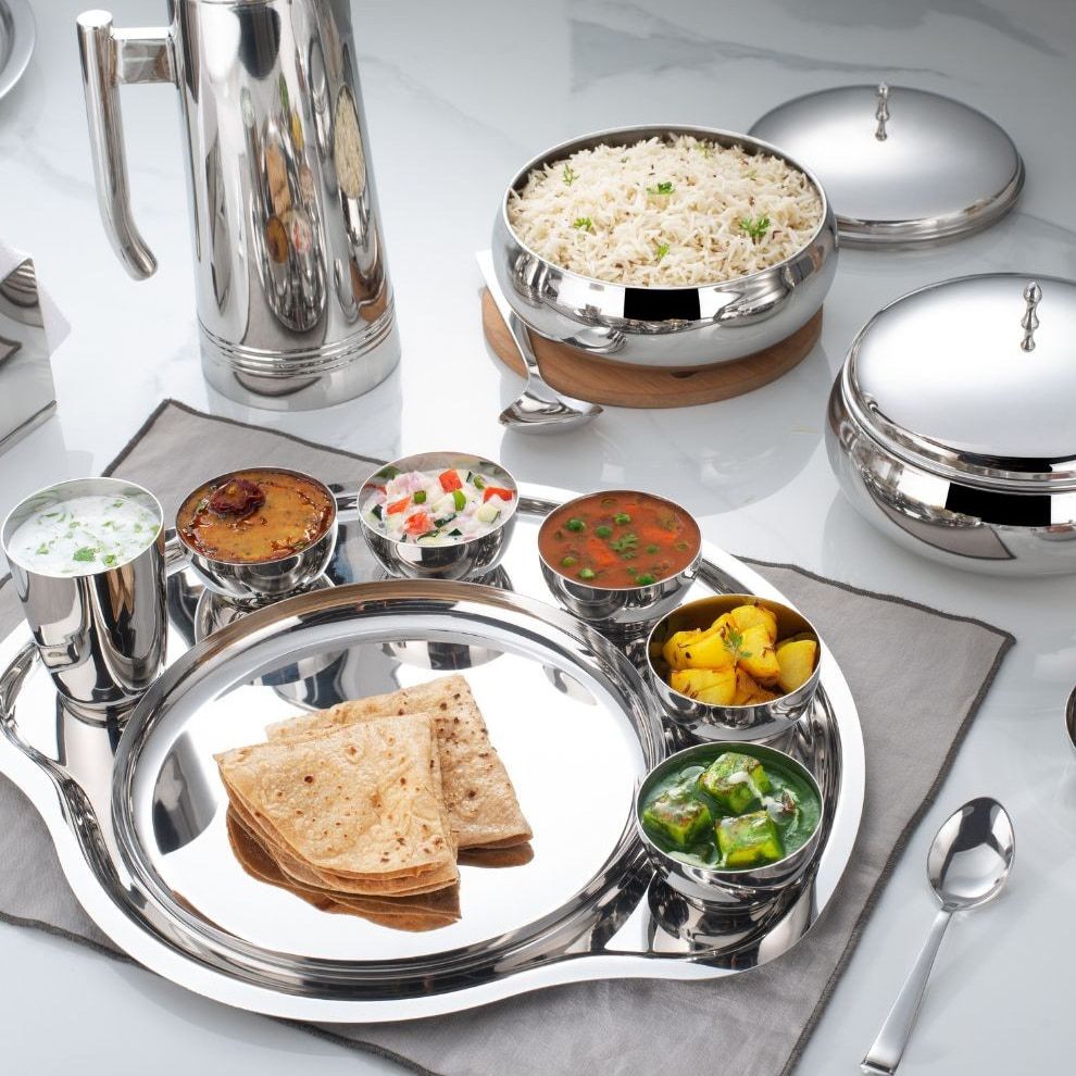 A mirror-steel Steelcraft thali laid with a full meal